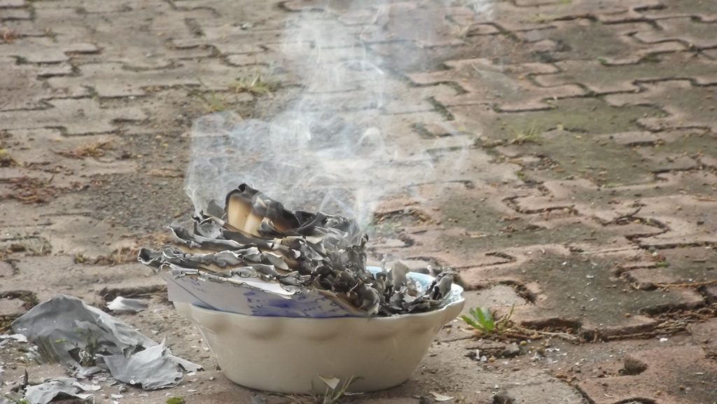 Burning paper in a burn-friendly receptacle